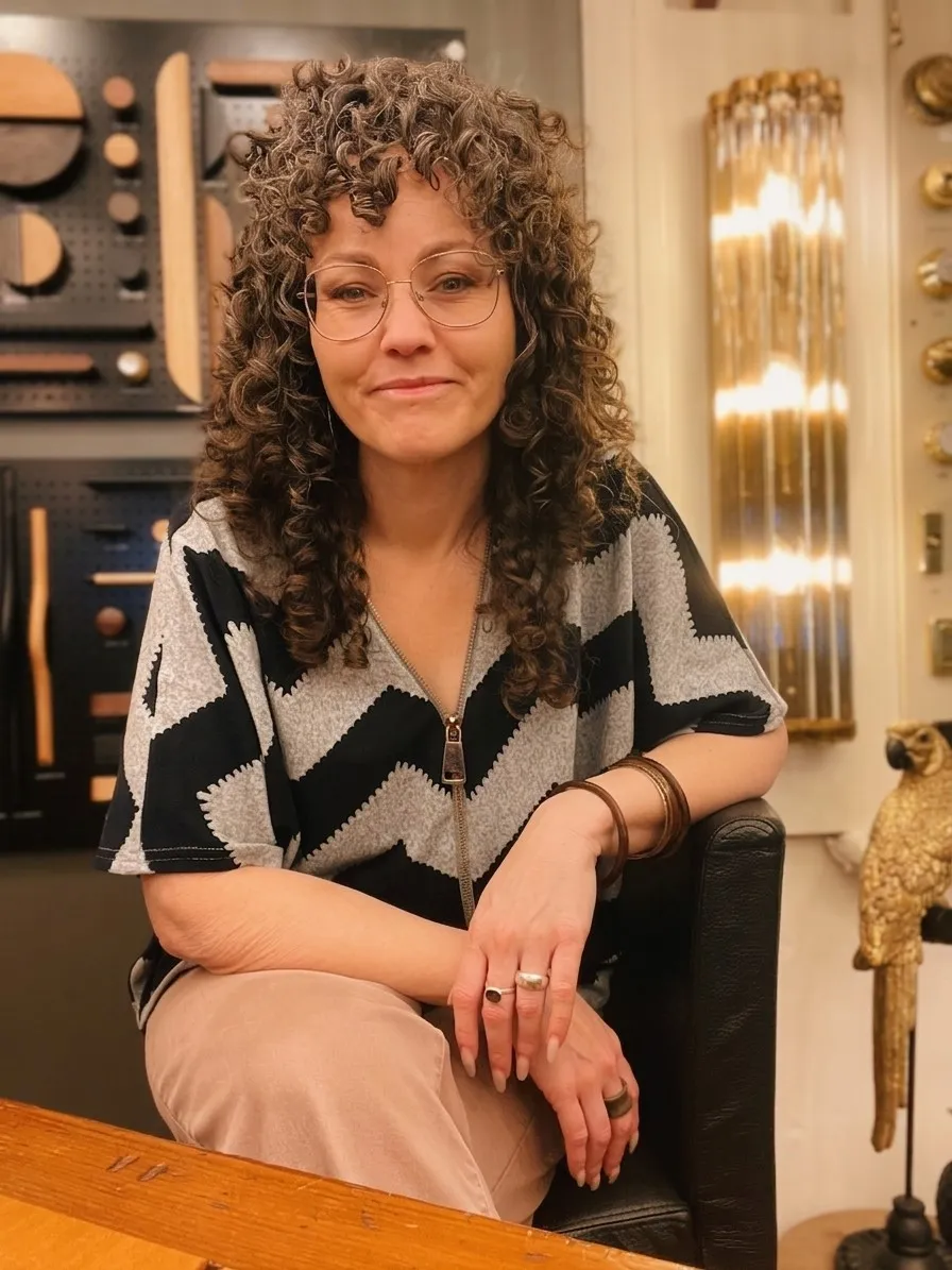Lynne-Marie Darwen in a lighting and hardware showroom